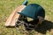 High angle view of cricket helmet and bat on field