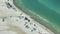 High angle view of crowded Siesta Key beach in Sarasota, USA. Many people enjoing vacations time swimming in ocean water