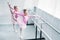 high angle view of cute little ballet dancers stretching