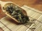 High angle view of dry mugwort on wooden spoon. Chinese herbal medicine. With copy space