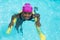 High angle view of girl swimming with pool noodle