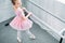 high angle view of graceful little ballerina exercising