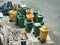 High Angle View of Group of Garbage Bins and Pile of Black Plastic Bags