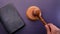 High angle view of hand holding gavel on black background