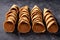 High angle view of hand made waffle ice cream cones in a row, selective focus