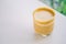 High angle view Iced coffee on white table next a window with nature outside