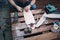 High angle view of man fitting up truck on wooden skateboard