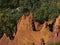 High angle view of orange colored ochre rock formations at Colorado Provencal in Luberon valley near Rustrel, Provence, France.