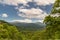 High-angle view over green Blueridge parkway and mountains cloudy sky sunlight, SC, USA