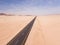 High angle view over a highway stretching through the desert