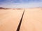 High angle view over a highway stretching through the desert