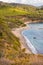 High angle view over Norsi Beach, dark sand beach situated in the gulf of stella, Elba island, Italy