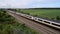 High angle view of Passing French highspeed train in rural summer natural landscape, High-voltage direct current on the