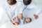 high angle view of pediatricians listening breath of little baby