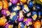 High-angle view of a pile of colorful wrapped Easter egg chocolates