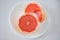 High angle view of Pink grapefruit half and slices