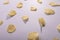 High angle view of potato chips arranged side by side on gray background