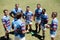 High angle view of rugby team discussing