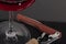 High angle view with shallow depth of field of a glass of red wine with a sommelier tools