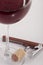 High angle view with shallow depth of field of a glass of red wine with a sommelier tools