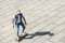 high angle view of stylish young skater riding longboard