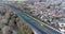 A high angle view of traffic on a dual carriageway passing next to a village in Suffolk