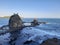 High angle view on two rock islands creeping out of wavy ocean