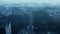 High angle view of wide street and railway track leading through town. Morning shot through sparse fog or low clouds