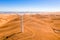 High angle view of wind turbines on beautiful golden mountain landscape in California