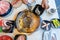 High angle view of woman putting shrimp into the hotpot