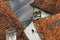 High angle view of worn rooftops and chimneys of house in old town of Petrovaradin, now part of Novi Sad