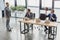 high angle view of young businessmen using laptops and playing with soccer and basketball balls