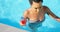 High angle view of young mixed-race woman walking with cocktail glass in swimming pool 4k