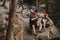 high angle view of young trial bikers relaxing on rocky cliff after ride