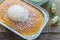 High angle views close up a cup of Hokkaido milk bread with topping cream on a wooden table with a cup of milk in the morning