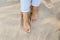 high angle woman feet sand beach. High quality photo