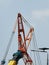 High arms of crane in building site.truck crane with hanging hook.