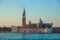 High bell tower and the Church of Saint George called San Giorgio Maggiore in Venice. Italy