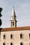 High bell tower of the Church of St. John in Budva. Montenegro