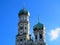 High bell tower with onion dome Gothic church architecture in blue sky