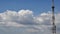 High blue sky and white clouds with communication tower