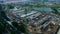 High building construction site. Big industrial tower crane and cityscape on background. Aerial drone view. Jakarta city developme