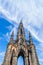 High Catholic temple, spire, tower, on sky background