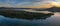 High cloud sunrise winter waterscape panorama