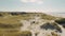 High Contrast 8k Top Shot Of Beachgoers And Children Playing In Grassland