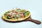 `A high contrast Hero shot of a Bruschetta Al Pesto Spinaci Pizza, on a minimal white background with a 30 degree angle from zoome