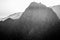 High contrast mountain with sharp edge, black and white with smokey background