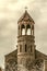 High cylindrical bell tower of St.Mesrop Mashtots Church in the village of Oshakan