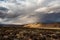 High desert landscape to distant hills with OHV dirt track