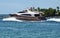 High-end cabin cruiser exiting Government Cut in Miami,Florida,heading for the open ocean,